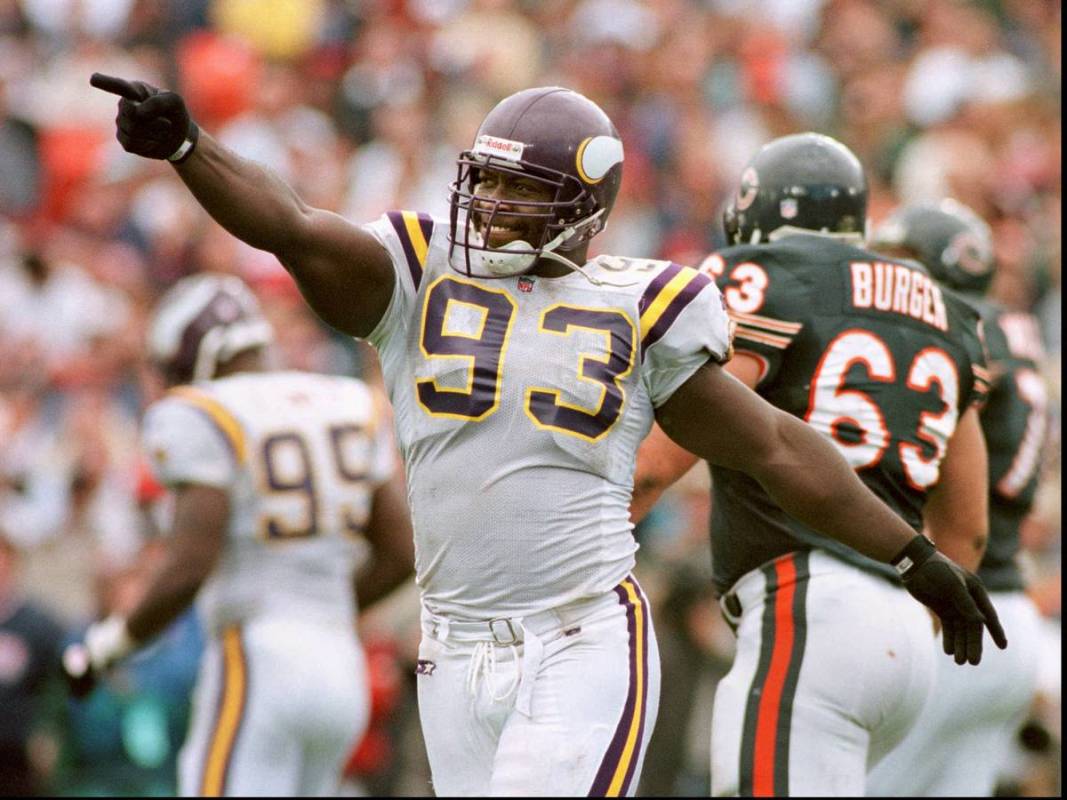 FILE - This Aug. 15, 1996, file photo shows Minnesota Vikings' John Randle celebrating after di ...