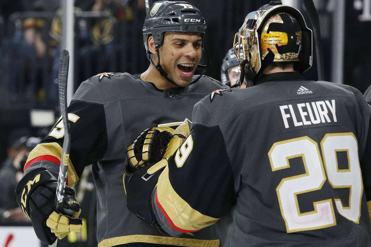 Vegas Golden Knights' Ryan Reaves, left, celebrates with goaltender Marc-Andre Fleury after def ...