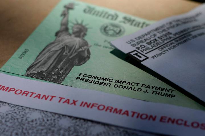 President Donald J. Trump's name is printed on a stimulus check issued by the IRS to help comba ...