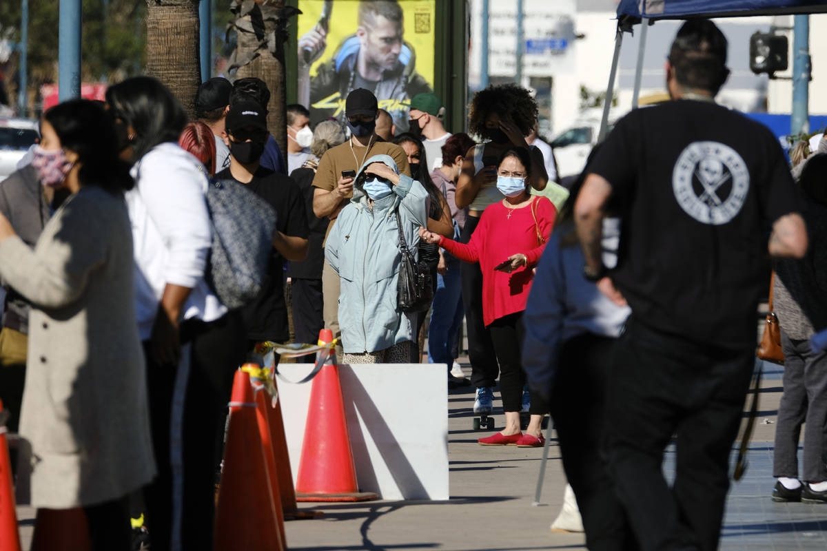 People wait in line to be tested for COVID-19 at a testing site in the North Hollywood section ...