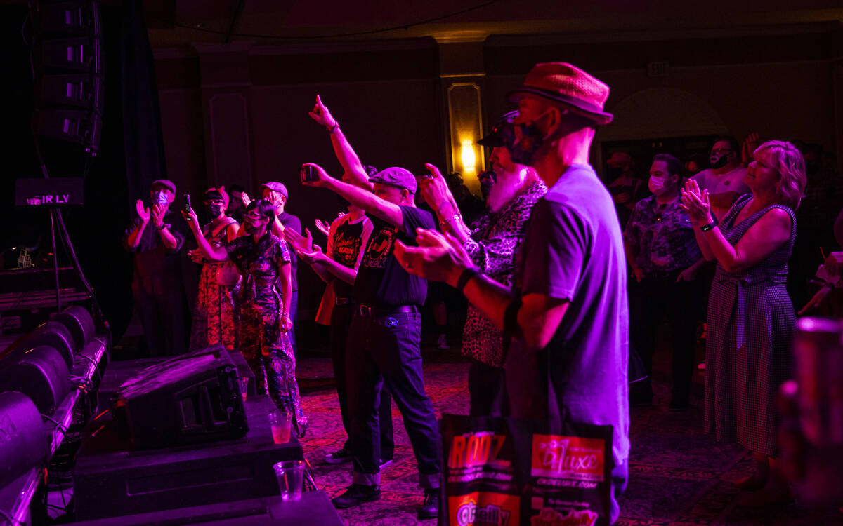 Attendees cheer as Las Vegas band Shanda & the Howlers perform during the first day of Viva ...