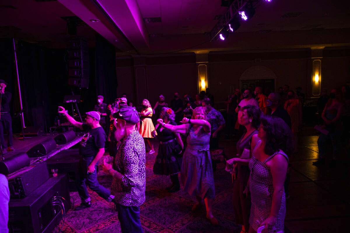 Attendees dance as Las Vegas band Shanda & the Howlers perform during the first day of Viva ...