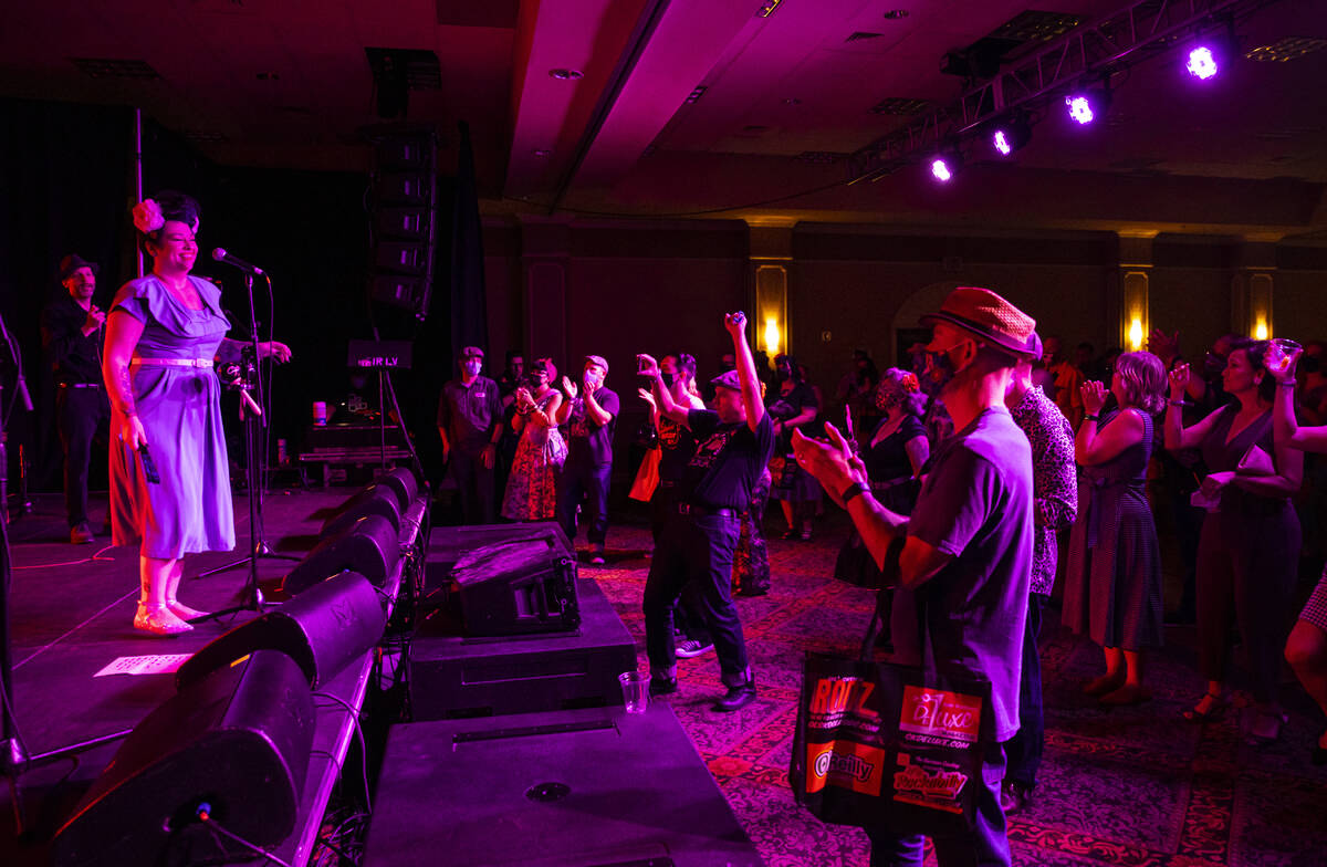 Attendees cheer as Las Vegas band Shanda & the Howlers perform during the first day of Viva ...