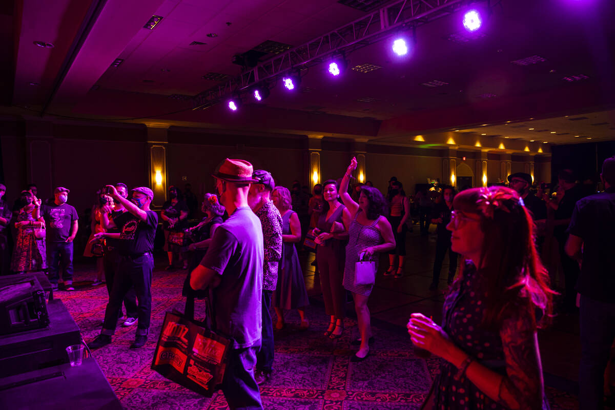 Attendees cheer as Las Vegas band Shanda & the Howlers perform during the first day of Viva ...