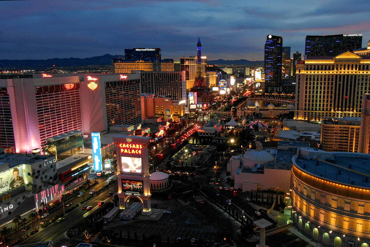 Aerial view looking south down the Las Vegas Strip at sunset on Monday, December 6, 2021. (Mich ...