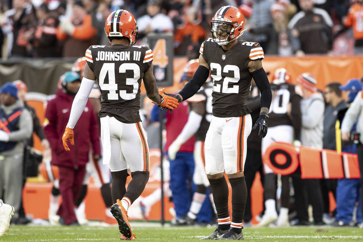 Cleveland Browns free safety John Johnson (43) celebrates with defensive back Grant Delpit (22) ...