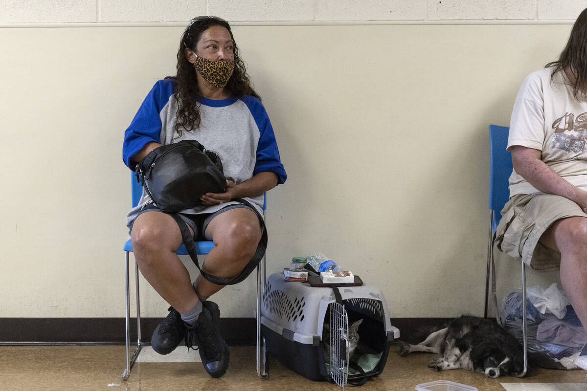 Charline Shiroma, who moved from California to Las Vegas last month, takes refuge from the heat ...