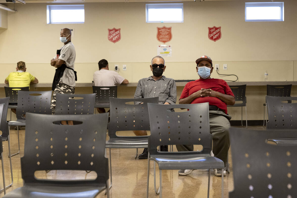 Individuals take refuge from the heat in the cooling center at Salvation Army Southern Nevada o ...