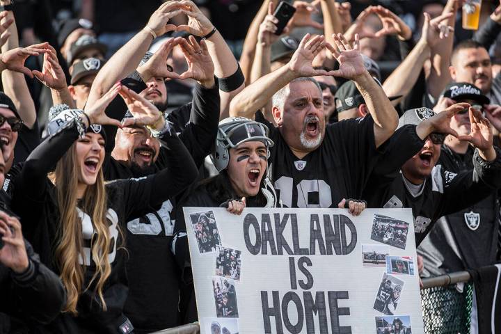 Raiders fans cheer for Oakland during an NFL football game with the Jacksonville Jaguars at the ...