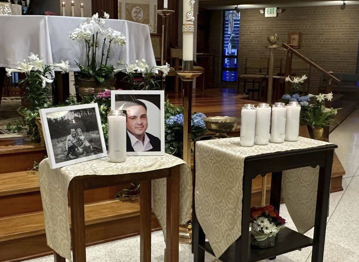 A memorial for Joshua Barrick is on display, late Monday, April 10, 2023, at Holy Trinity Catho ...