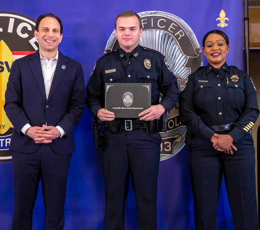 In this photo provided by the Louisville Metro Police Department, from left, Louisville Mayor C ...