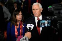 Former Vice President Mike Pence talks to reporters in the spin room after a Republican preside ...