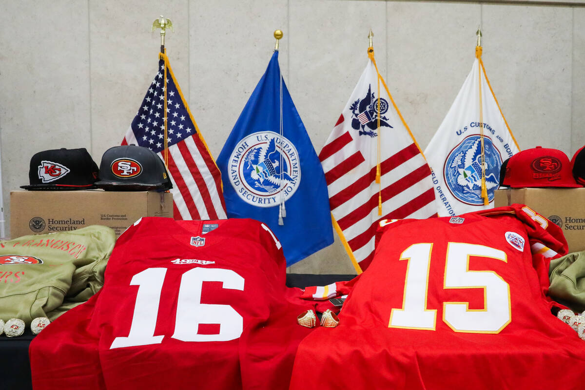 A display of fake super bowl paraphernalia is seen during a Super Bowl LVIII safety press confe ...