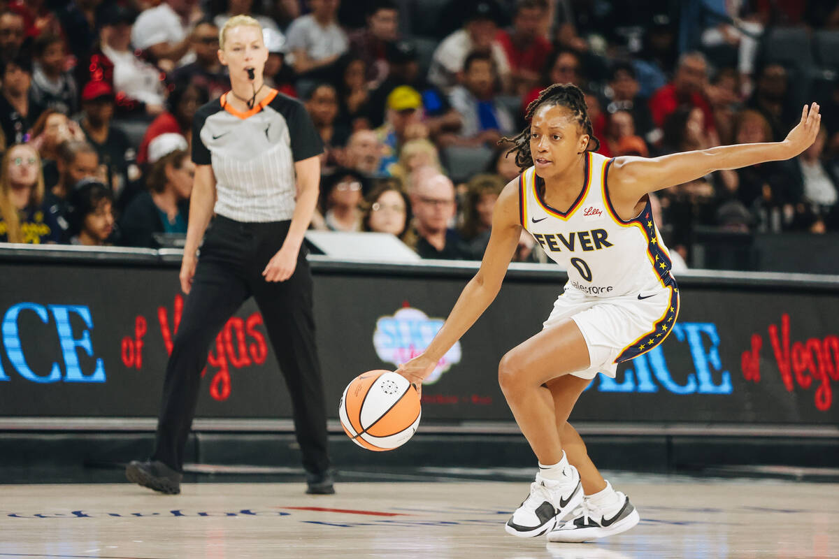 Indiana Fever guard Kelsey Mitchell (0) dribbles the ball during a game between the Aces and In ...