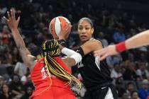 Las Vegas Aces center A'ja Wilson (22) is defended by Washington Mystics forward Aaliyah Edward ...