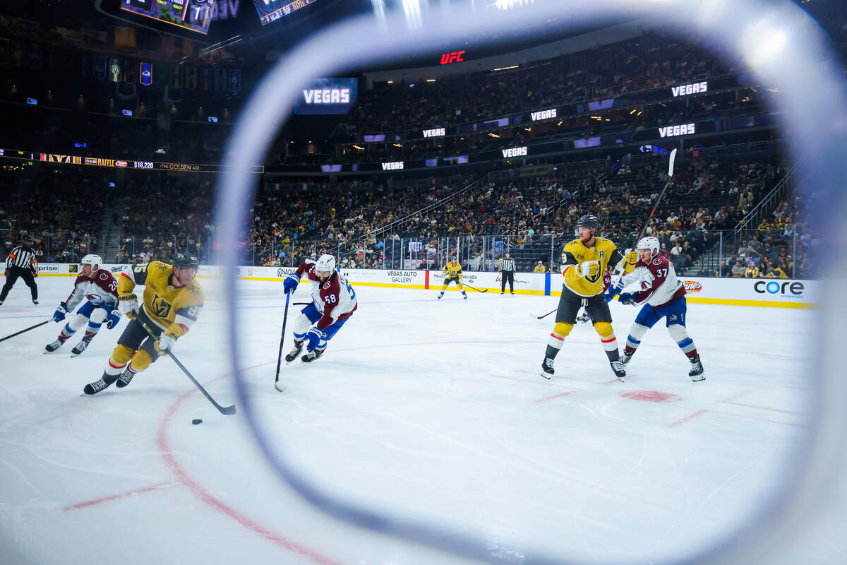 Golden Knights right wing Victor Olofsson (95) skates the puck over during the third period of ...