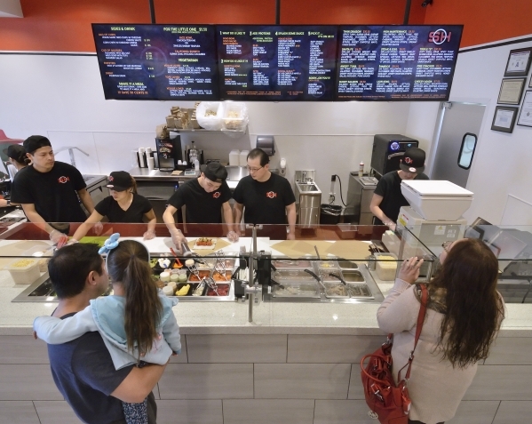 Customers watch as their food is prepared at Soho SushiBurrito at 2600 W. Sahara Ave. in Las Vegas on Saturday, Feb. 6, 2016. Bill Hughes/Las Vegas Review-Journal