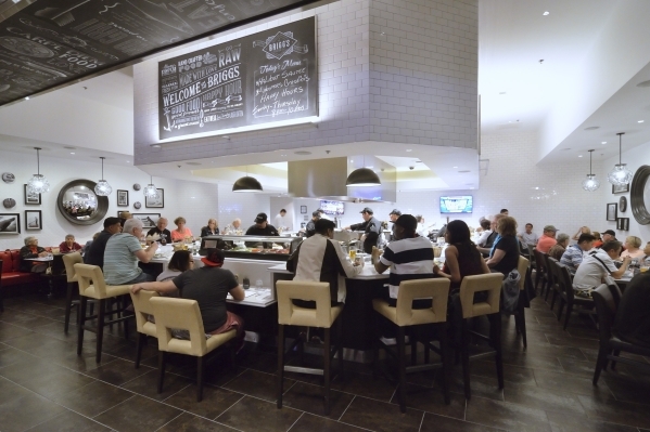 Brigg‘s Oyster Co. evokes a classic oyster bar, lined with gleaming white subway tile with chalkboard art, and most of the cooking goes on in the center of the room in an area surrounded by  ...