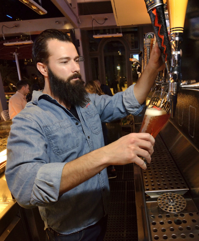 Bartender Joe Surdy pulls a beer at the Beer Park in the Paris hotel-casino at 3655 Las Vegas Blvd. South in Las Vegas on Saturday, March 12, 2016. Bill Hughes/Las Vegas Review-Journal