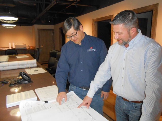 Chris Rowe and Holden Hsiao, vice president of Shaw-Lundquist Associates, look over blueprints Jan. 11, 2016, of current projects at company headquarters, 5662 Las Costa Canyon Court. Linda J. Sim ...