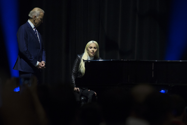 Lady Gaga, right, and Vice President Joe Biden speak to the crowd after Gaga performing "Til It Happens to You" during an event aimed at preventing sexual assault on college campuses in coordinati ...