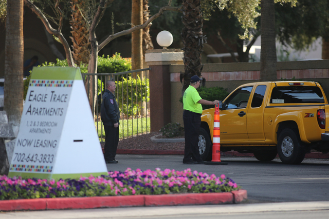 Security guards screen cars as they enter Eagle Trace Apartments near Nellis Air Force Base in northeast Las Vegas on Friday, April 22, 2016. (Brett Le Blanc/Las Vegas Review-Journal) Follow @bleb ...