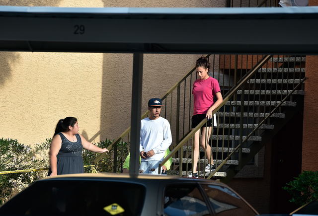 People look on as Las Vegas police investigate an apparent stabbing at the Sunridge Apartments along East Vegas Valley Drive near Nellis Boulevard Monday, May 16, 2016, in Las Vegas. David Becker/ ...