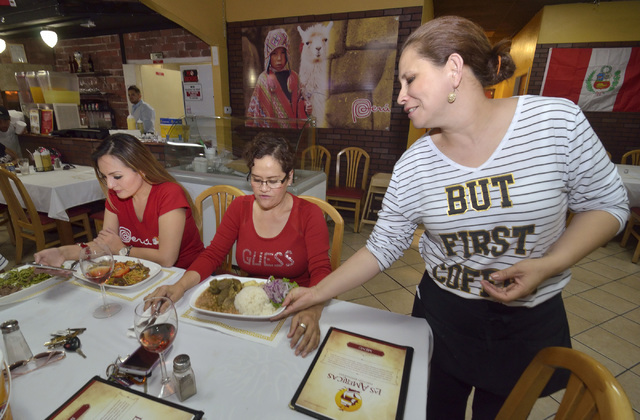 Janeth Barrezueto, right, serves Sally Zuniga, left, and her mother Maria at Las Americas at 2319 S. Eastern Ave. in Las Vegas Las Vegas June 17, 2016. Bill Hughes/Las Vegas Review-Journal