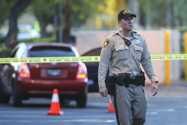 Las Vegas police investigate a homicide outside of a Walgreens at Lake Mead and Jones Boulevards in Las Vegas on Wednesday, June 29, 2016. (Chase Stevens/Las Vegas Review-Journal) Follow @cssteven ...