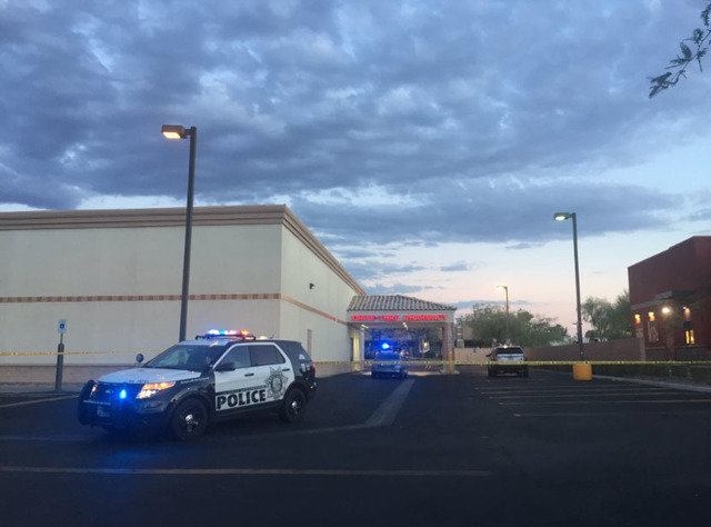 Las Vegas police investigate a homicide outside of a Walgreens at Lake Mead and Jones Boulevards in Las Vegas on Wednesday, June 29, 2016. (Rachel Crosby/Las Vegas Review-Journal)