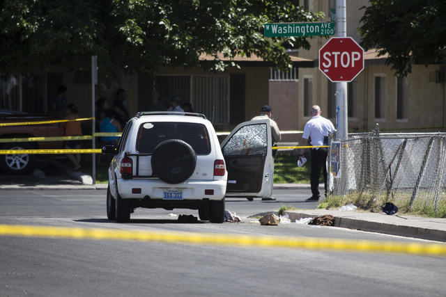 The scene of a shooting near Tonopah Drive and Washington Avenue is seen on Wednesday, June 1, 2016, in Las Vegas. Erik Verduzco/Las Vegas Review-Journal Follow @Erik_Verduzco