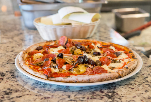 A fresh hot pizza is shown sitting on the counter in La Bella Napoli atTown Square in Las Vegas on Friday, July 22, 2016. Donavon Lockett/Las Vegas Review-Journal
