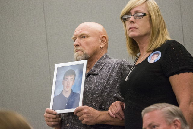 Donald Brill, left, and his wife Karen Brill-Kelley, parents of 16-year-old boy Aric Brill who was gunned down in 2009, stand in court for the first appearance of four men charged in the murder of ...