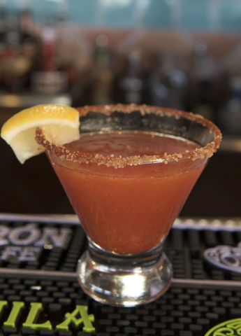 A Red Chile strawberry spiked lemonade sits on the bar at Carlito's Burritos/Live Fire Q in Henderson Friday, July 15, 2016. Jason Ogulnik/Las Vegas Review-Journal
