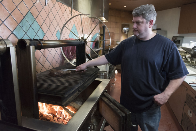 Carlito's Burritos/Live Fire Q, owner, Dave Samuels grills tri-tip on a santa maria style barbecue grill pit at his restaurant in Henderson Friday, July 15, 2016. Jason Ogulnik/Las Vegas Review-Jo ...