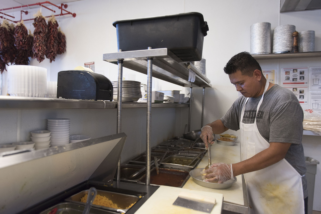 Lorenzo Rojas prepares a stuffed sopapilla at Carlito's Burritos/Live Fire Q in Henderson Friday, July 15, 2016. Jason Ogulnik/Las Vegas Review-Journal