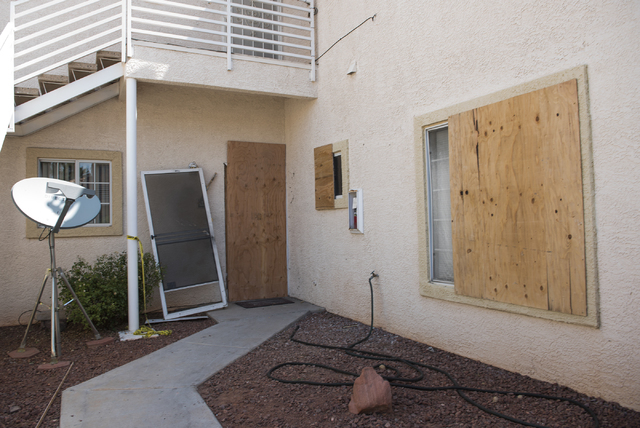 A unit is boarded up at Torrey Pines Condominiums in Las Vegas on Thursday, June 30, 2016. Neighbors said the unit is where three children were found shot dead Wednesday night.Police said Jason De ...