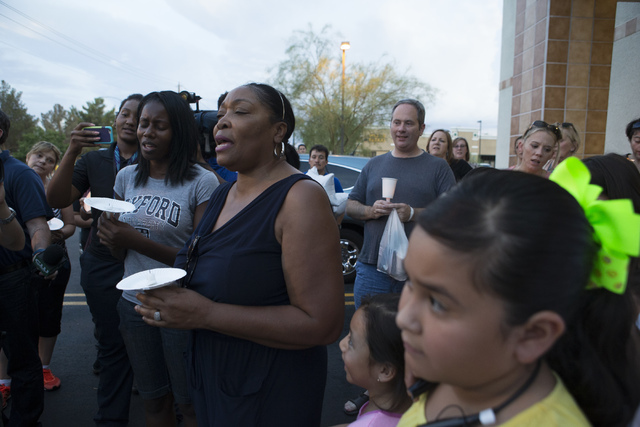 Community members sing during a candlelight vigil for the victims of a murder-suicide on Friday, July 1, 2016 in Las Vegas. Loren Townsley/ Las Vegas Review-Journal Follow @LorenTownsley