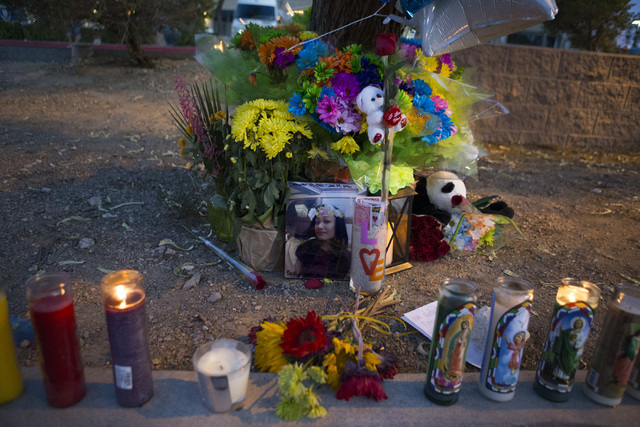 Items placed by community members are shown during a candlelight vigil for the victims of a murder-suicide on Friday, July 1, 2016 in Las Vegas. Loren Townsley/ Las Vegas Review-Journal Follow @Lo ...
