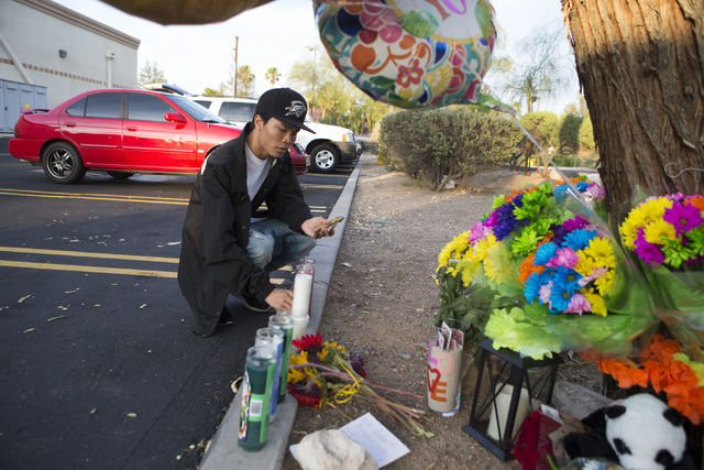 Nick Saelee pays his respects at a candlelight vigil for the victims of a murder-suicide on Friday, July 1, 2016 in Las Vegas. Loren Townsley/ Las Vegas Review-Journal Follow @LorenTownsley