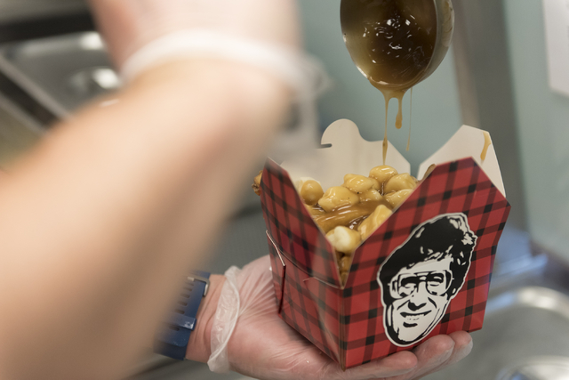 Robert Buckel, co-owner of Smoke's Poutinerie at Pawn Plaza, prepares traditional poutine at his restaurant in Las Vegas Friday, July 8, 2016. (Jason Ogulnik/Las Vegas Review-Journal)