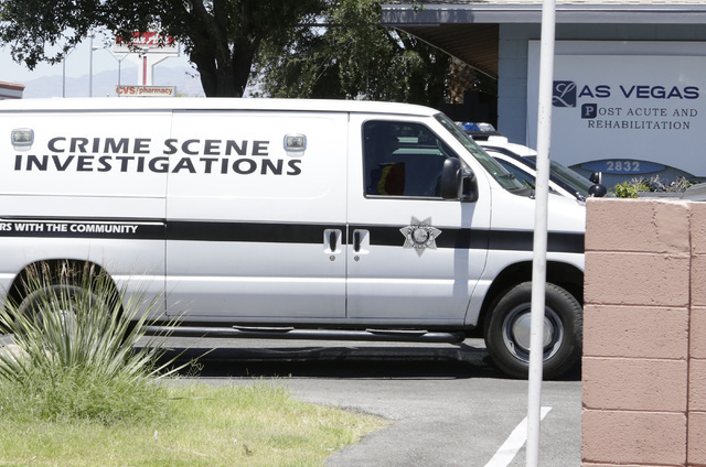 Metro police department's crime scene investigation van arrives at Las Vegas Post Acute & Rehabilitation where a couple died in what police are describing as a murder-suicide, Wednesday, July  ...