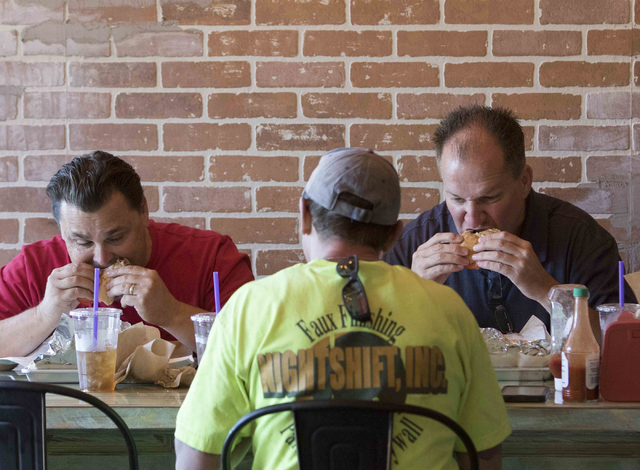 Scott Flaningan, from left, Shawn Spencer and Dave Duggan eat lunch at Zydeco Po-Boys restaurant in downtown Las Vegas on Friday, Aug. 12, 2016. Richard Brian/Las Vegas Review-Journal Follow @vega ...