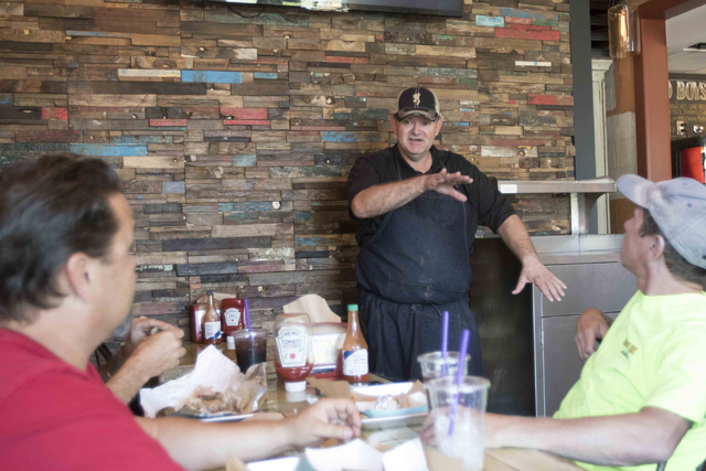 Zydeco Po-Boys owner Brandon Trahan, standing rear, speaks with guest dining at his restaurant in downtown Las Vegas on Friday, Aug. 12, 2016. Richard Brian/Las Vegas Review-Journal Follow @vegasp ...