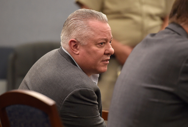 David Frostick looks to his defense attorney in court on Friday at the Regional Justice Center in Las Vegas. Frostick was sentenced to 20 years to life in prison for the murder of his fiancee in 2 ...