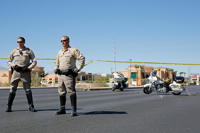 Police officers block off Rainbow Boulevard in Las Vegas, Sunday, Sept. 25, 2016, after a shooting inside a Starbucks at a southwest valley strip mall. Chitose Suzuki/Las Vegas Review-Journal
