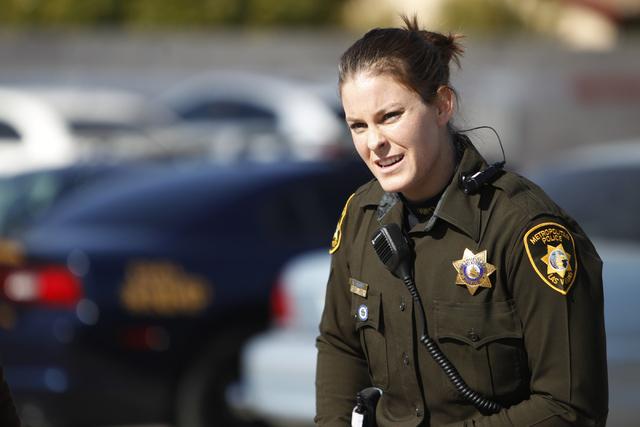Las Vegas police officer Nicole Hemsey gets ready for a role play a police traffic stop scenario during a presentation of the department's body cameras for the media at the Mojave Training Center  ...