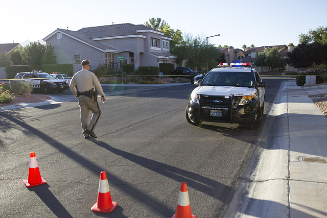 The scene near a shooting is seen at the intersection of Hillsgate Street and Staffords Spring Drive on Tuesday, Oct. 4, 2016, in Las Vegas. (Erik Verduzco/Las Vegas Review-Journal) Follow @Erik_V ...