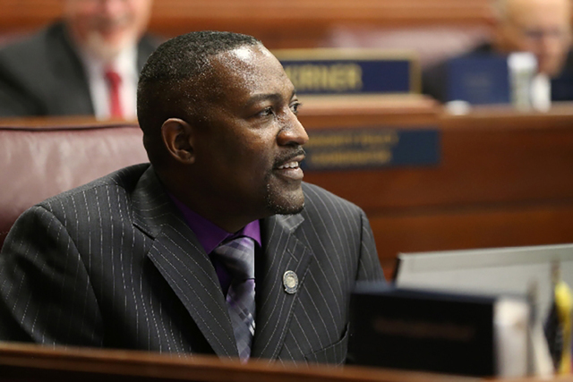 Assemblyman Tyrone Thompson, D-North Las Vegas, works on the Assembly floor during the final hours of the 77th Legislative session. He is a key proponent of the ban-the-box effort to remove barrie ...