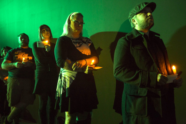 Attendees wait to read the names of victims who were killed due to anti-transgender hatred or prejudice during a Transgender Day of Remembrance vigil held at The Space on Sunday, Nov. 20, 2016. Ri ...